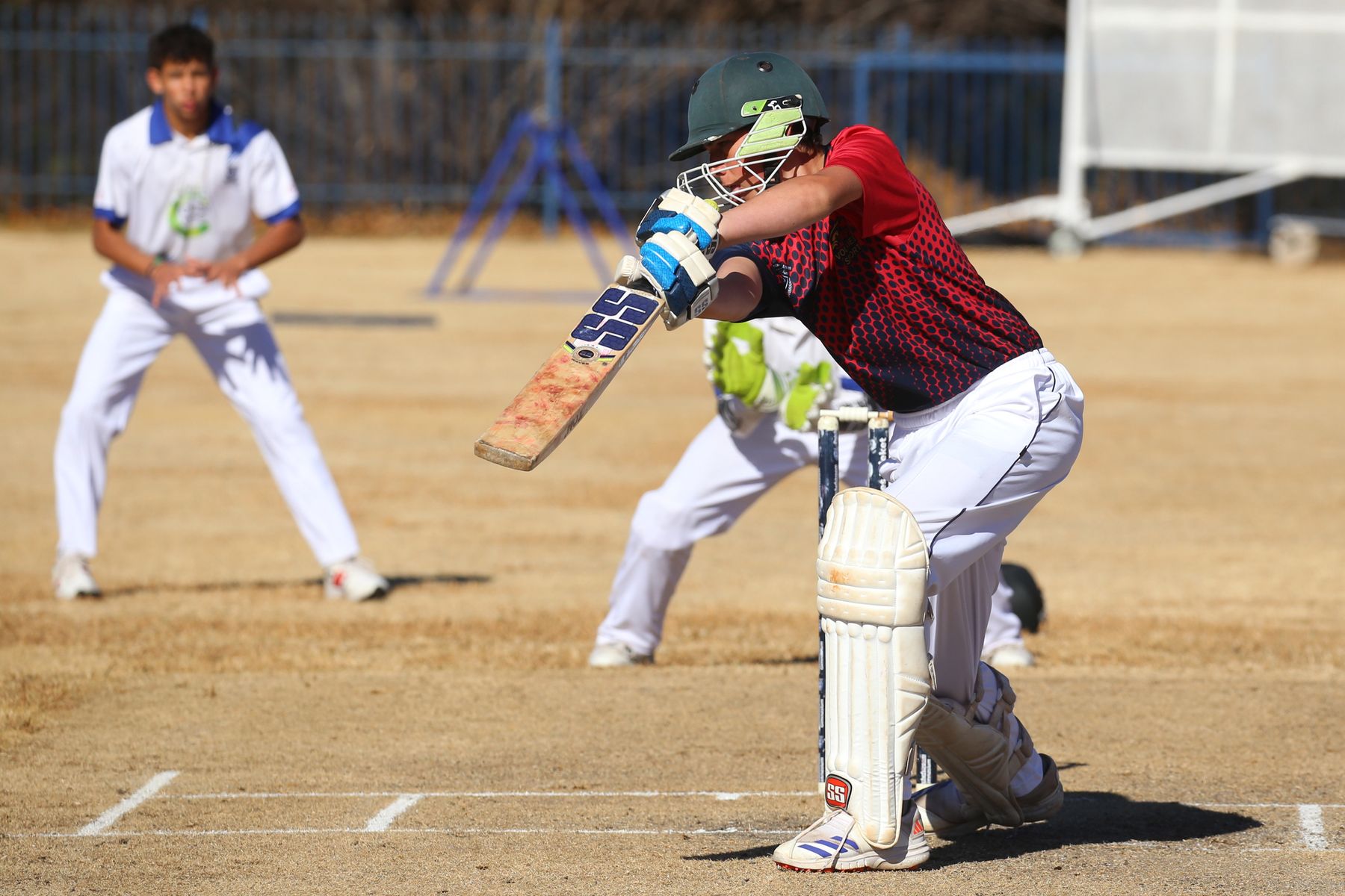 Batsman playing a cricket shot during a match